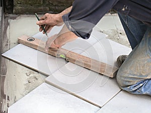 Marking a floor tile for cutting