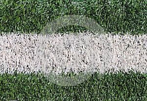 Marking a green artificial football field with a grass cover in the city stadium. The place for conducting competitions and