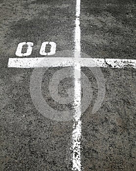 Marking lines and numbers on the asphalt surface