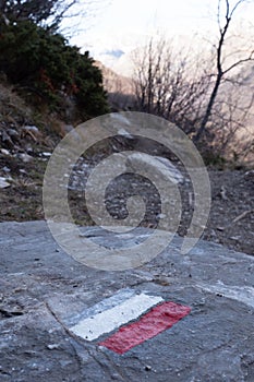 Marking of a long-distance hiking route, white and red, Itineraries in France, Marking on rock, Hiking trail photo