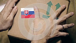 Marking package with the Slovakian flag label. Import or export in Slovakia