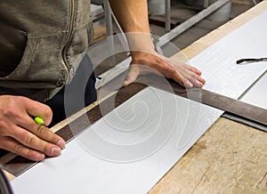 Marking a strip of metal with a square