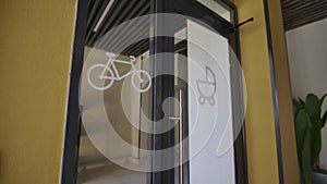 Markings on glass doors allow entry by bicycles and strollers