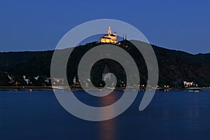 Marksburg over the Rhine illuminated in the evening seen from the west