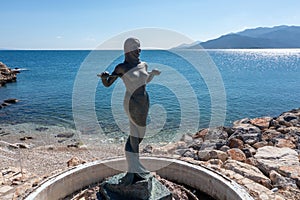 Marmaid Statue at Paralio Astros beach, Peloponnese, Greece. Aerial drone view of Gorgona Stheno photo