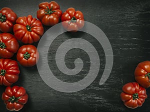 Marmande tomatoes on slate background