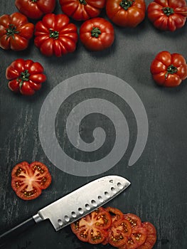 Marmande tomatoes, slices and knife