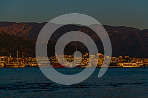 MARMARIS, TURKEY: Landscape with a view of the old town, Fortress and ships in Marmaris at sunset.