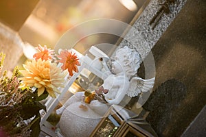 Marmoreal white Angel at the cemetery, sorrow, sunlight photo