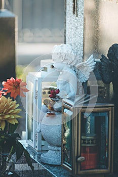 Marmoreal white Angel at the cemetery, sorrow, sunlight photo
