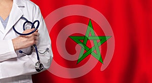 Maroccan medicine and healthcare concept. Doctor close up against flag of Marocco background