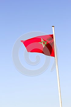 Maroccan national flag swinging in the air