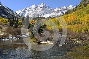 Maroon Bells and Creek in Autumn photo