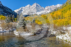 Maroon Bells and Creek in Autumn Snow photo