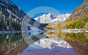 Maroon Bells in fall foliage after snow storm in Aspen, Colorado