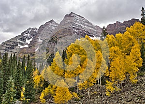 Maroon Bells peaks and fall colors in the Rocky Mountain National Park photo