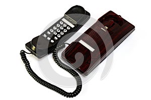 A maroon black colored home analogue line phone