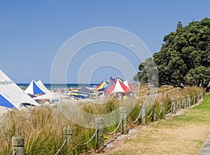 Marquees and people erected at beach event