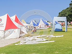 Marquees and people erected at beach event