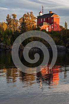 Marquette Harbor Lighthouse at sunset in the fall along Lake Superior