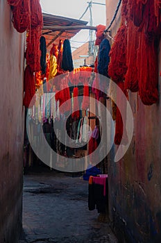 Marrakech - dyed wool drying in the sun on a street Marocco, January 2019