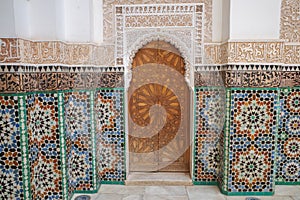 Marrakech, Morocco - Feb 10, 2023: Beautiful handicraft work inside the koranic school Medersa Ben Youssef in Marrakech photo