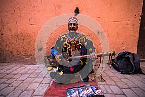 TStreet musician in traditional clothing on street