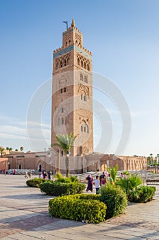 Marrakesh, Morocco - September 05 2013: Koutoubia Mosque with local people and sqaure on sunny day