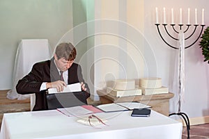 Marriage celebrant preparing documents for wedding