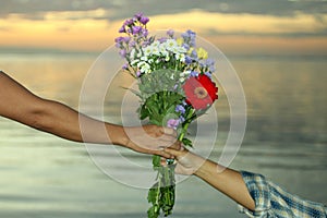 Marriage proposal with beautiful flowers bouquet. Romantic marriage proposal concept