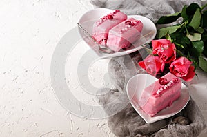 Marriage proposal. ring, pink cakes, roses on white background. Free space for your text.