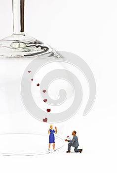 Marriage proposal seperated by a glass