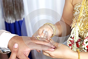 Marriage thai wedding rings, bride put the wedding ring on groom, bride put the ring on groom, thai wedding ceremony and wedding