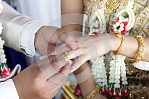 Marriage thai wedding rings, groom put the wedding ring on bride, bride put the ring on groom, thai wedding ceremony and wedding