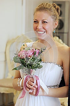 Marriage Wedding day moment. Bride portrait.Bride holds a beautiful wedding dress