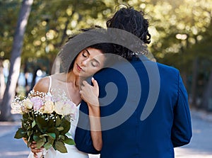 Married couple, bride and groom hug with love, care and celebration in outdoor garden. Wedding, marriage and romance