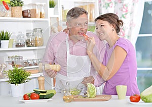 Married couple cooking together photo
