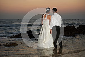 Married couple enjoing at sea beach photo