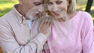 Married couple enjoying outdoor date, laughing together, relation closeness photo