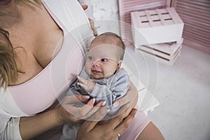 Married couple holds in arms tiny smiling daughter