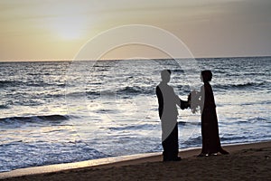 Married couple stands happy at