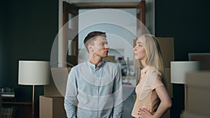 Married pair disputing home close up. Grumpy blond wife shouting on husband.