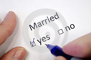 Married status form, Marital Status form, Questionnaire. The answer is in the test with a checkbox. Pen on a white sheet of paper
