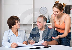 Marrieds is singing documents with their adult daughter