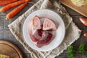 Marrow bones and meat with vegetables - ingredients to prepare homemade bone broth