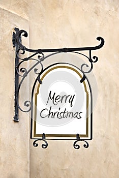 Marry Christmas on a wrought iron old sign