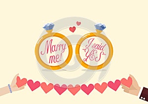 Marry me and I said yes with hands holding line paper of hearts