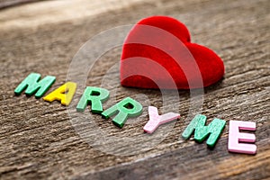 Marry me message written by colour paper