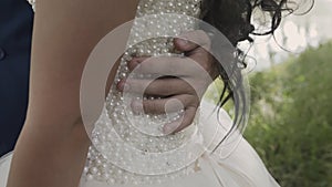 Marry me today and everyday. Newlywed couple holding hands, shot in slow motion.