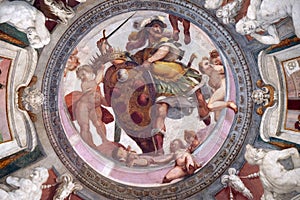 Mars holds the Medici coat of arms between putti fresco by Bernardino Poccetti Ospedale degli Innocenti, Florence, Italy